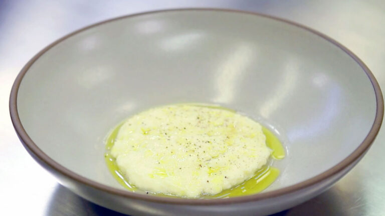 a poached scrambled egg in a large gray bowl