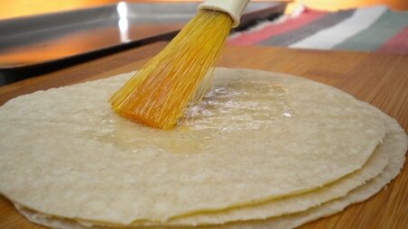 brushing-tortillas-with-oil-resized